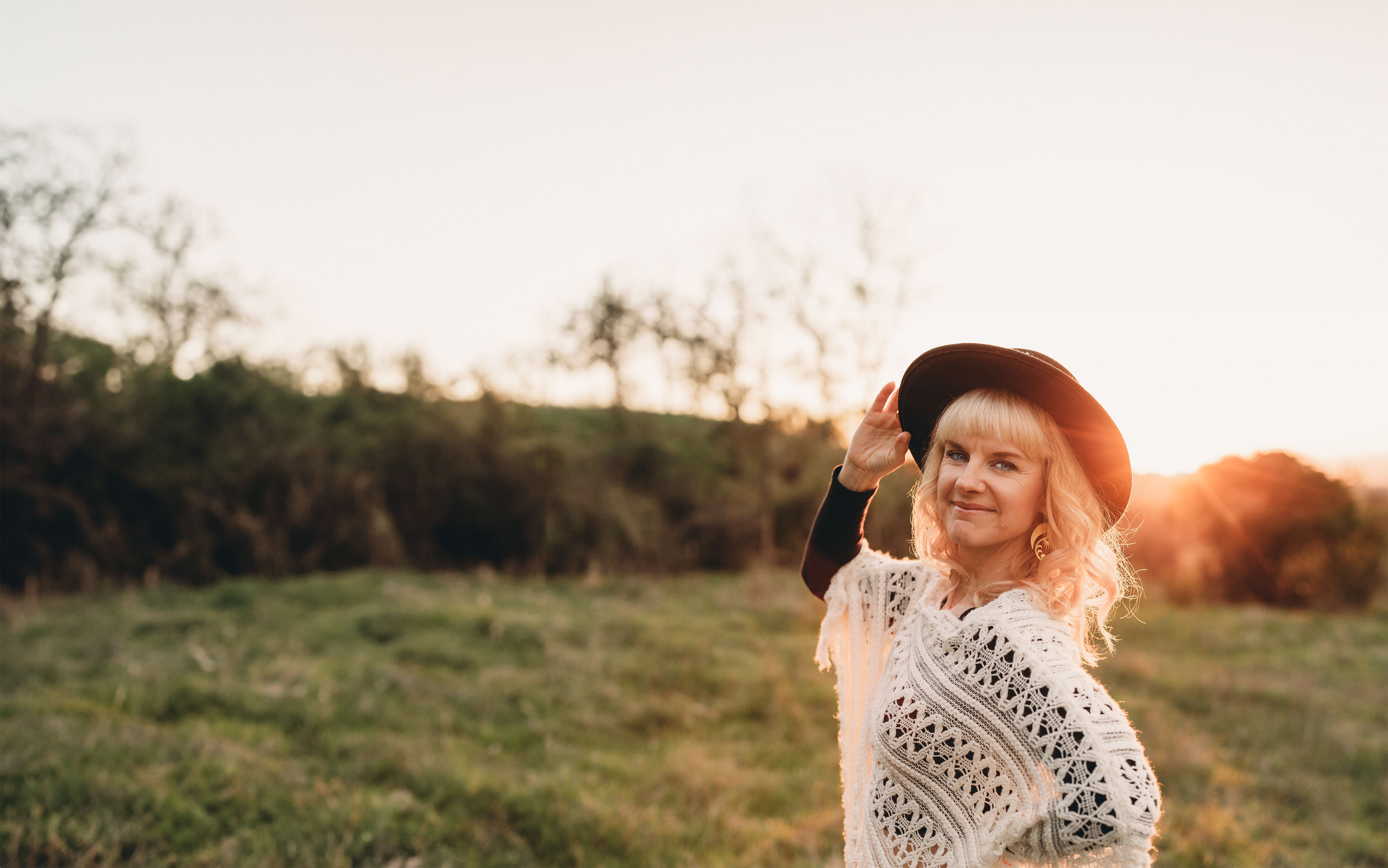 Chris Young-Ginzburg in a golden sunset field